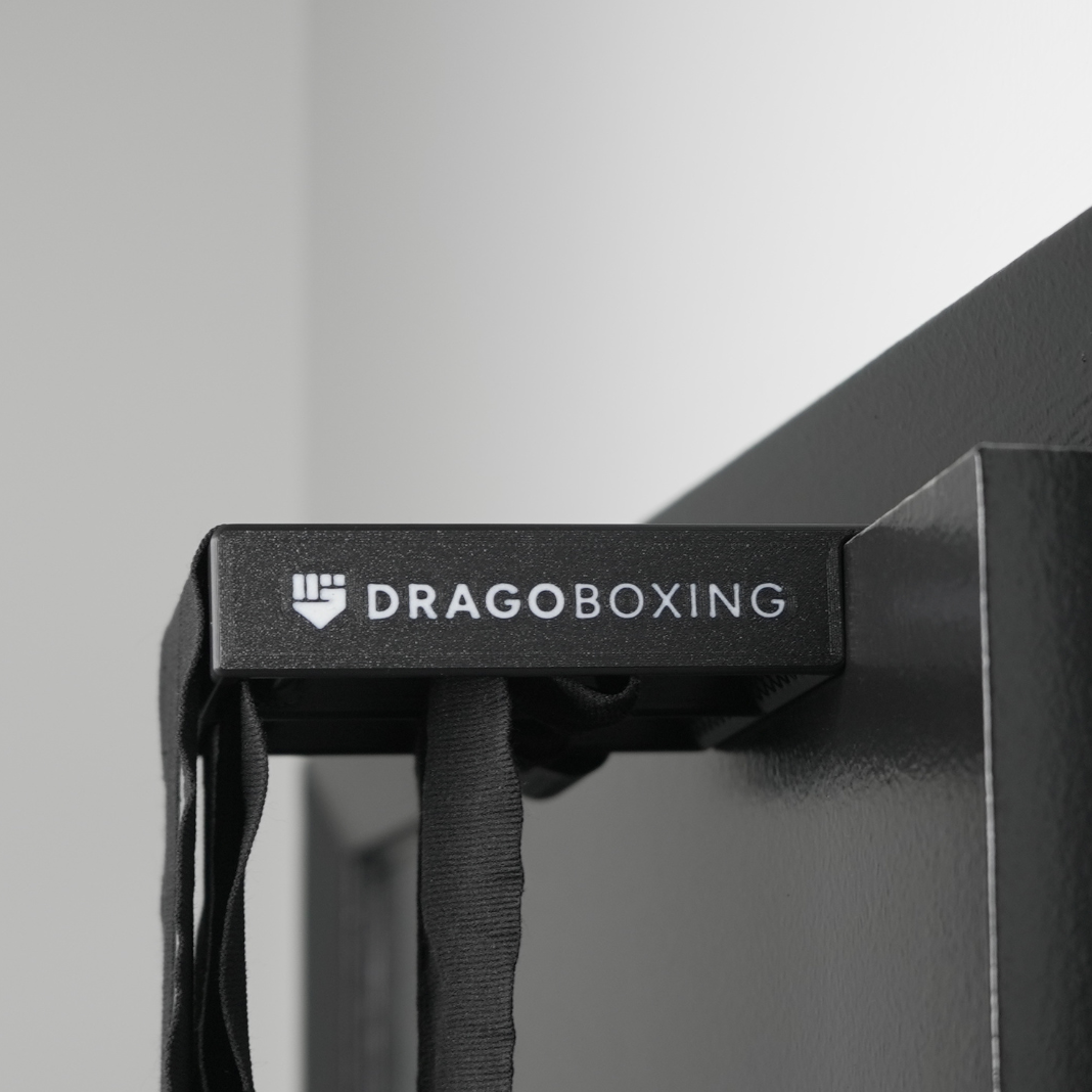 Drago Roller in use rolling two 180 inch boxing hand wraps simultaneously
